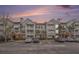 Three-story building with brick and siding, balconies, and ample parking at 45 Sycamore Ave # 523, Charleston, SC 29407