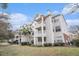 Exterior of the building with landscaping and balconies at 45 Sycamore Ave # 523, Charleston, SC 29407