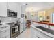 Updated kitchen features stainless steel appliances and granite countertops at 45 Sycamore Ave # 523, Charleston, SC 29407