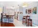 Kitchen with white cabinets, a breakfast bar, and modern appliances at 45 Sycamore Ave # 523, Charleston, SC 29407