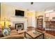 Living room with fireplace, hardwood floors, and a built-in bookcase at 45 Sycamore Ave # 523, Charleston, SC 29407