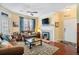 Living room with fireplace, hardwood floors, and comfortable seating at 45 Sycamore Ave # 523, Charleston, SC 29407