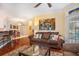 Living room with hardwood floors, fireplace, and access to balcony at 45 Sycamore Ave # 523, Charleston, SC 29407