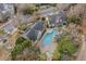 Community pool with surrounding lounge chairs at 45 Sycamore Ave # 523, Charleston, SC 29407