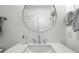 Modern bathroom vanity with a round mirror and chrome fixtures at 4545 Park Lake Dr, Kiawah Island, SC 29455