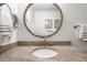 Bathroom featuring granite vanity and a large round mirror at 4545 Park Lake Dr, Kiawah Island, SC 29455
