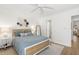 Bedroom with a blue comforter and ceiling fan at 4545 Park Lake Dr, Kiawah Island, SC 29455