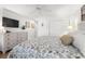 Bedroom with dresser, TV, and patterned bedding at 4545 Park Lake Dr, Kiawah Island, SC 29455