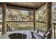 Wooden deck with two chairs and view of backyard and trees at 4545 Park Lake Dr, Kiawah Island, SC 29455