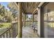 Deck with wooden posts, American flag and stairs leading down at 4545 Park Lake Dr, Kiawah Island, SC 29455