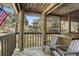 Wooden deck with two Adirondack chairs and view of trees at 4545 Park Lake Dr, Kiawah Island, SC 29455