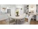Open concept dining area with built-in shelving and kitchen view at 4545 Park Lake Dr, Kiawah Island, SC 29455
