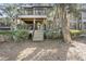Two-story home with large deck and lush landscaping at 4545 Park Lake Dr, Kiawah Island, SC 29455