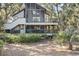 Two-story home with screened porch and deck at 4545 Park Lake Dr, Kiawah Island, SC 29455