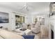 Living room with patio access, comfortable seating, and fireplace at 4545 Park Lake Dr, Kiawah Island, SC 29455
