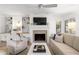 Living room boasts a fireplace, built-in shelving, and a cozy sitting area at 4545 Park Lake Dr, Kiawah Island, SC 29455