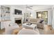 Bright living room with fireplace, built-ins, and access to patio at 4545 Park Lake Dr, Kiawah Island, SC 29455