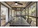 Screened porch with dining table and access to living room at 4545 Park Lake Dr, Kiawah Island, SC 29455