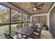 Spacious screened porch with dining area and seating at 4545 Park Lake Dr, Kiawah Island, SC 29455