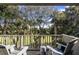 Relaxing balcony overlooks lush golf course and trees at 4995 Green Dolphin Way, Kiawah Island, SC 29455