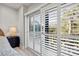 Bedroom with sliding door and plantation shutters at 4995 Green Dolphin Way, Kiawah Island, SC 29455