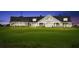 Large clubhouse with wrap-around porch and green at 4995 Green Dolphin Way, Kiawah Island, SC 29455