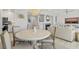 Light-filled dining area features round table and four chairs at 4995 Green Dolphin Way, Kiawah Island, SC 29455
