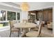 Casual dining area with round table and four chairs, sunroom access at 4995 Green Dolphin Way, Kiawah Island, SC 29455