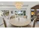 Bright dining room with round table and four chairs, open layout at 4995 Green Dolphin Way, Kiawah Island, SC 29455