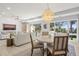 Elegant dining room features a round table and view to the deck at 4995 Green Dolphin Way, Kiawah Island, SC 29455