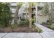 Well-maintained condo building nestled amongst palm trees and landscaping at 4995 Green Dolphin Way, Kiawah Island, SC 29455