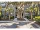 Condo building with mature trees and manicured landscaping at 4995 Green Dolphin Way, Kiawah Island, SC 29455