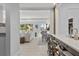Open concept kitchen with breakfast bar and view to living and dining areas at 4995 Green Dolphin Way, Kiawah Island, SC 29455