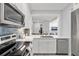 Bright kitchen featuring stainless steel appliances and white cabinets at 4995 Green Dolphin Way, Kiawah Island, SC 29455