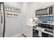 White cabinets and stainless steel appliances in a galley kitchen at 4995 Green Dolphin Way, Kiawah Island, SC 29455