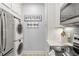 Stackable washer and dryer in a compact laundry room at 4995 Green Dolphin Way, Kiawah Island, SC 29455