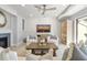 Relaxing living area with shiplap walls, comfortable seating, and large TV at 4995 Green Dolphin Way, Kiawah Island, SC 29455
