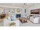 Living room with fireplace, comfortable seating and kitchen view at 4995 Green Dolphin Way, Kiawah Island, SC 29455