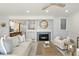 Bright living room with fireplace, comfortable seating, and access to deck at 4995 Green Dolphin Way, Kiawah Island, SC 29455