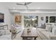 Open living area with access to deck and view of trees at 4995 Green Dolphin Way, Kiawah Island, SC 29455