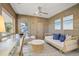 Peaceful sunroom with daybed, writing desk and coastal decor at 4995 Green Dolphin Way, Kiawah Island, SC 29455