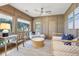 Bright sunroom features a comfy daybed and workspace with natural light at 4995 Green Dolphin Way, Kiawah Island, SC 29455