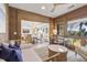 Sunroom with daybed, view into dining area, and natural light at 4995 Green Dolphin Way, Kiawah Island, SC 29455