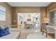 Open sunroom offers view into dining room and access to outdoor space at 4995 Green Dolphin Way, Kiawah Island, SC 29455