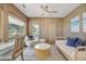 Relaxing sunroom boasts a daybed, seating area, and stunning natural light at 4995 Green Dolphin Way, Kiawah Island, SC 29455