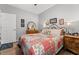 Cozy bedroom featuring a bed with a patterned quilt, wood floors, and soft, natural light at 5223 Lenora Dr, Summerville, SC 29485