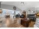 Open-concept living room with hardwood floors, decorative furnishings, and a view to the dining area at 5223 Lenora Dr, Summerville, SC 29485