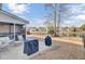Large backyard with patio, grill, and pond view at 5225 Mulholland Dr, Summerville, SC 29485