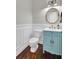 Powder room features a light blue vanity and ornate mirror at 5225 Mulholland Dr, Summerville, SC 29485