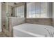 Modern bathroom featuring a soaking tub and a walk-in shower at 5225 Mulholland Dr, Summerville, SC 29485